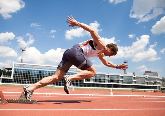 teen athlete running on track